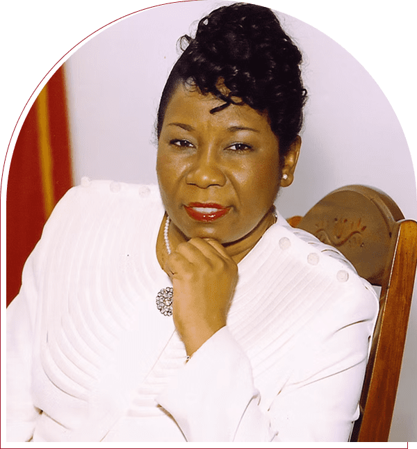 Woman in white suit with thoughtful expression