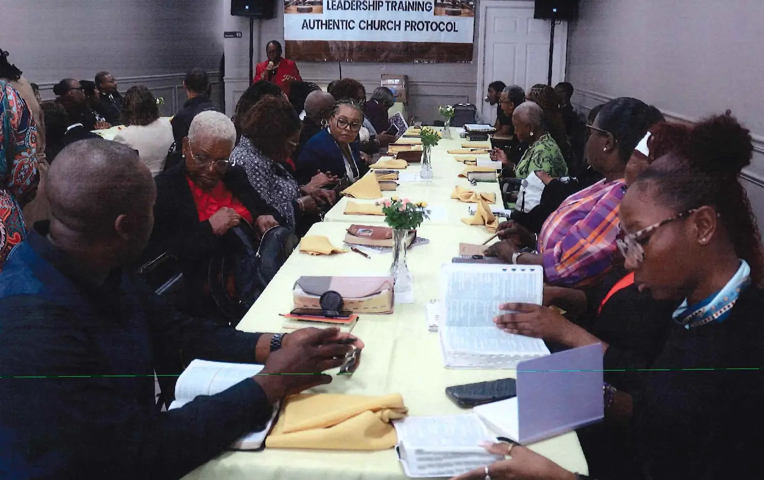 People gathered around a table for a meeting or discussion.