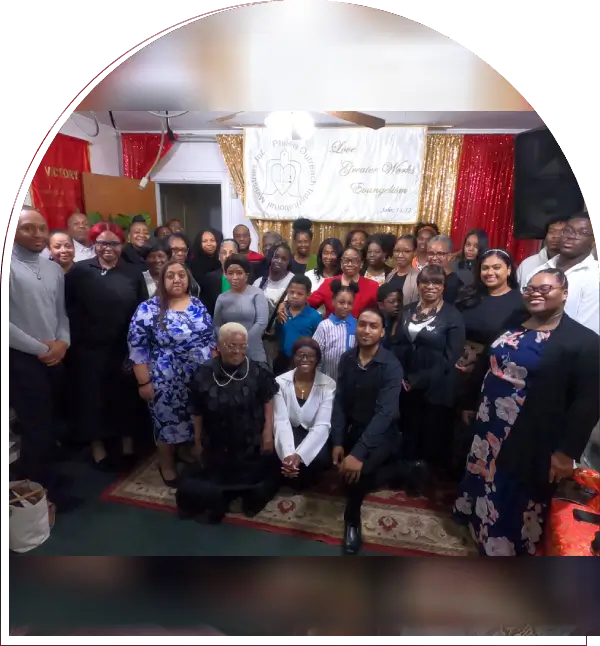 A large group of people posing indoors during an event.